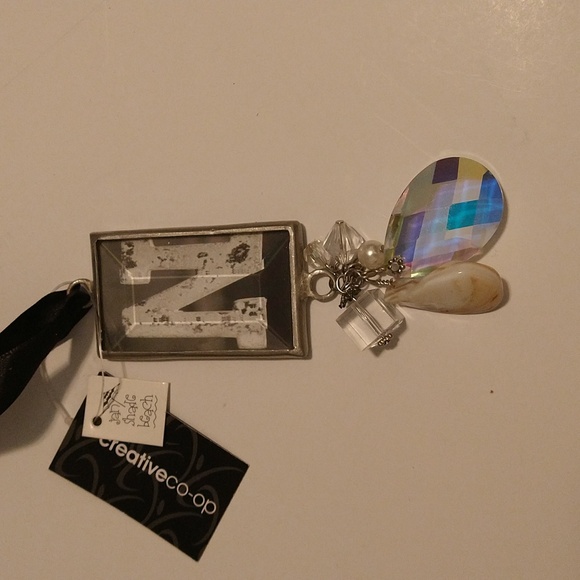 Hanging capital N crystal charm with a black satin tie - Picture 4 of 5